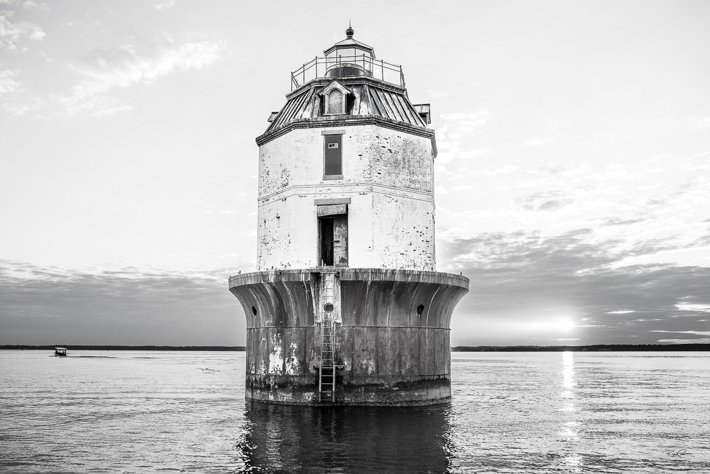 The Gilded Watchman (Monochrome Edition) — A high-contrast black and white photograph of the Point No Point sparkplug lighthouse in the Chesapeake Bay, with the sun setting on the horizon and a small boat in the distance.