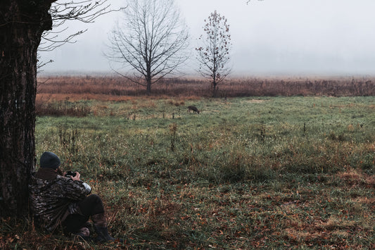 Chris Michael photographing wildlife from cover at the edge of a foggy Southern Maryland field