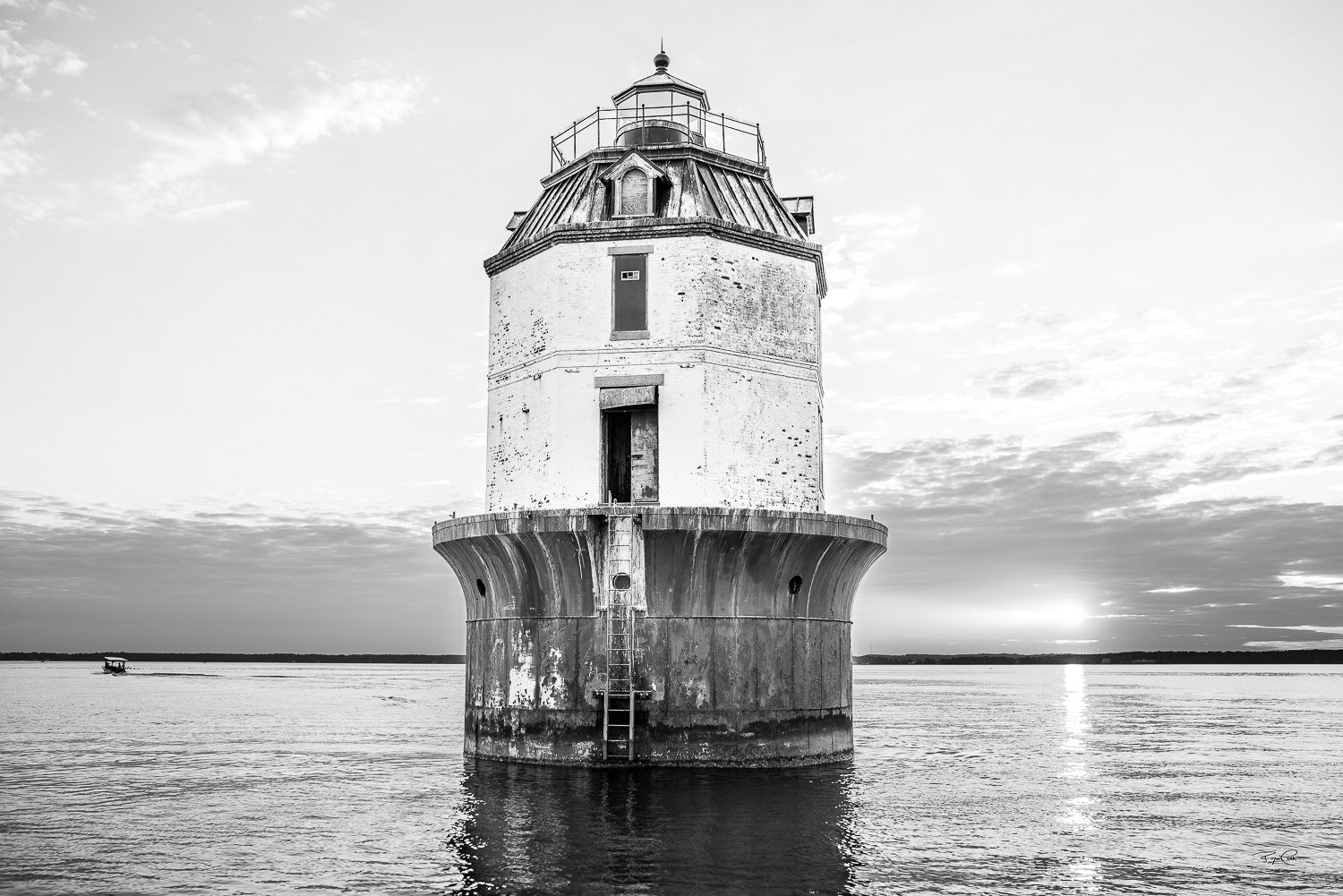 The Gilded Watchman (Monochrome Edition) — A high-contrast black and white photograph of the Point No Point sparkplug lighthouse in the Chesapeake Bay, with the sun setting on the horizon and a small boat in the distance.